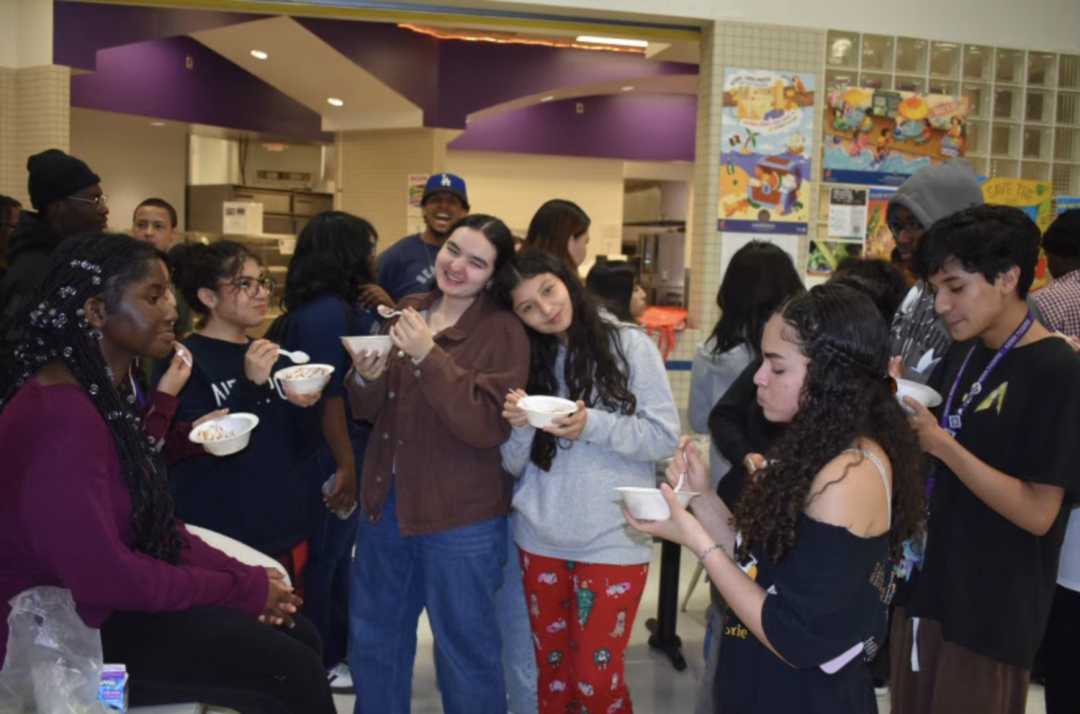 Endless Laughter
Joy Kazeem, Natalia Sorto, Daniela Leal, Greydis Landaverde, Ashlyn Yencle, and Moises Zuniga, talk and share jokes over ice cream at the CO'26 ice cream social. With a big turnout, much of the ice cream supply was left empty. "My favorite part was socializing with my club," Yencle said.